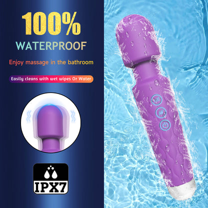 Purple handheld massager with water splashes on a blue background, featuring IPX7 waterproof rating.100% waterproof IPX7 rated Magic Wand massager used in water available in bikinisexzy 