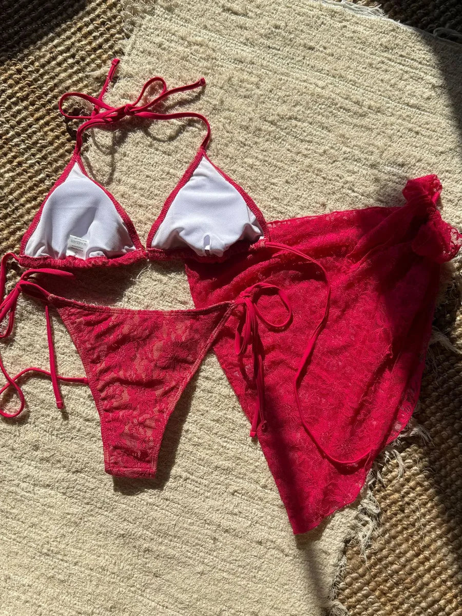 Red bikini set with white accents on a textured surface BIKINISEXZY summer beachwear collection 3-piece set
