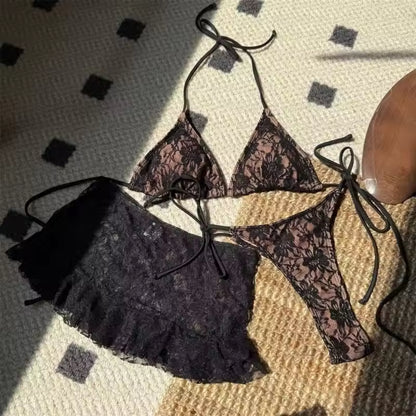 Lace bikini set on a textured surface BIKINISEXZY sexy 3-piece hollow-out tankini set front view