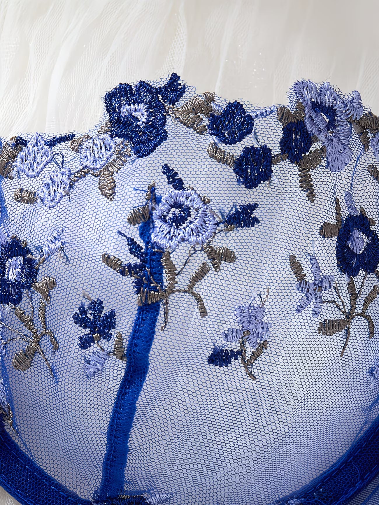 Close-up of blue floral 3D embroidery on sheer mesh bra cup – Bikinisexzy