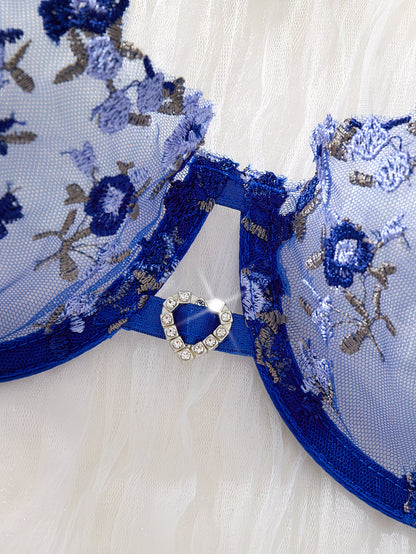 Close-up of rhinestone heart charm detail on blue embroidered mesh bra – Bikinisexzy