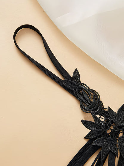 Luminous glow-in-the-dark green crackle glass beads on black lace thong in dark setting – Bikinisexzy