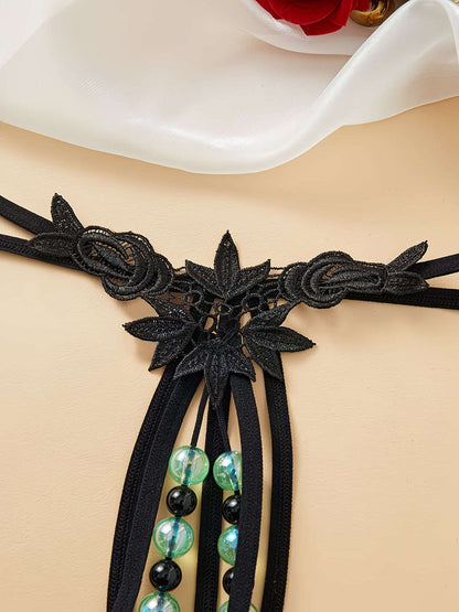 Close-up view of intricate embroidered rose and leaf butterfly floral lace - Bikinisexzy | Bikinisexzy.com

