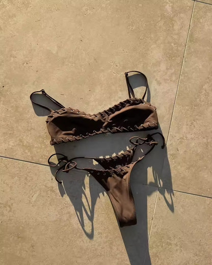 Brown bikini set on a beige tiled floor