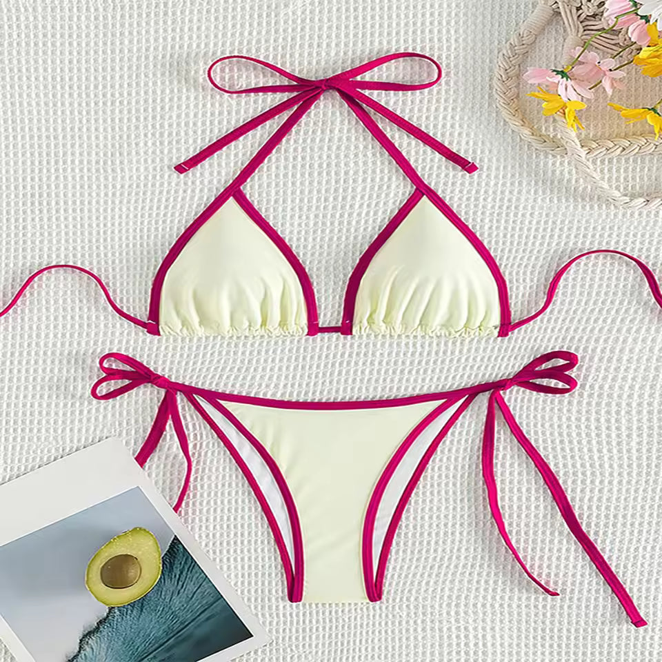 Bikini set with pink straps on a textured white surface.BIKINISEXZY low waist brazilian biquini swimwear