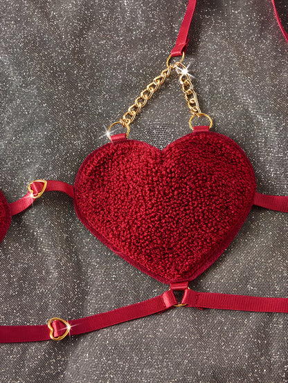 Red heart-shaped bralette with gold chain and heart details | Close-up shot of burgundy red heart-shaped bra cup - Bikinisexzy | Bikinisexzy.com