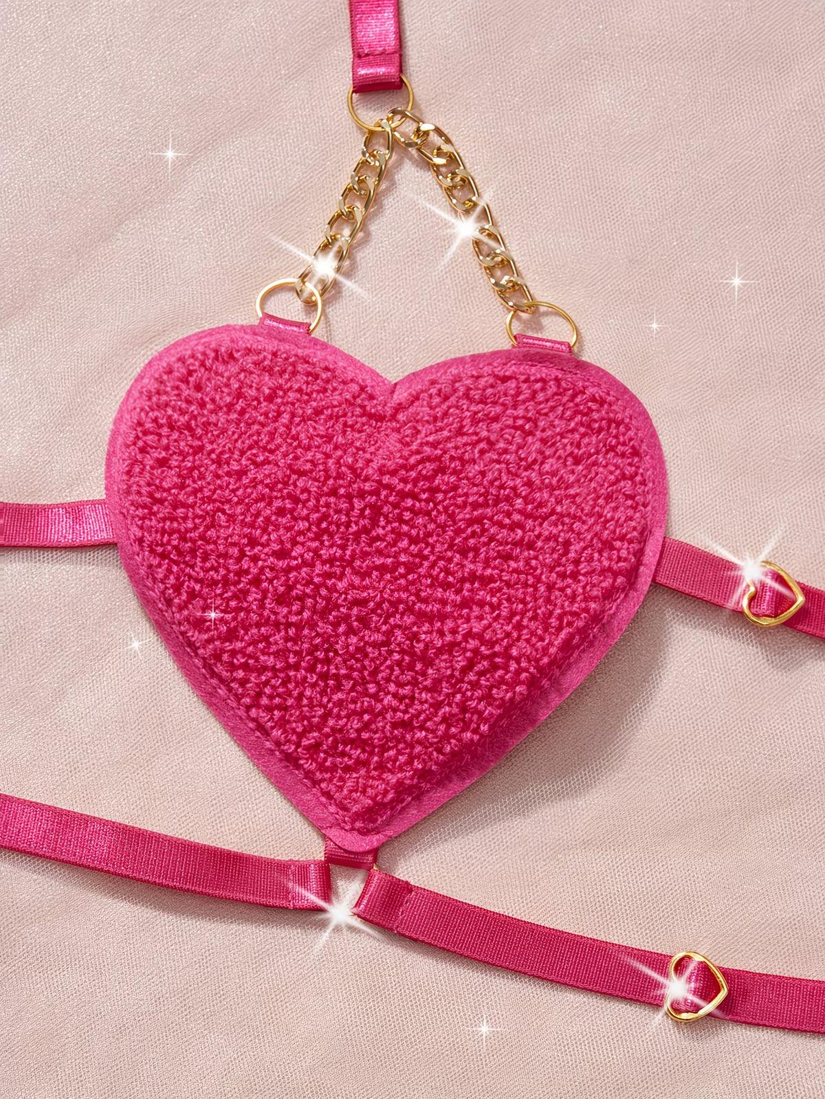 Close-up shot of hot pink plush heart-shaped bra cup with gold chain detail - Bikinisexzy | Bikinisexzy.com