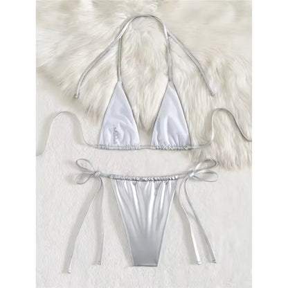 Silver bikini set on a white fur background