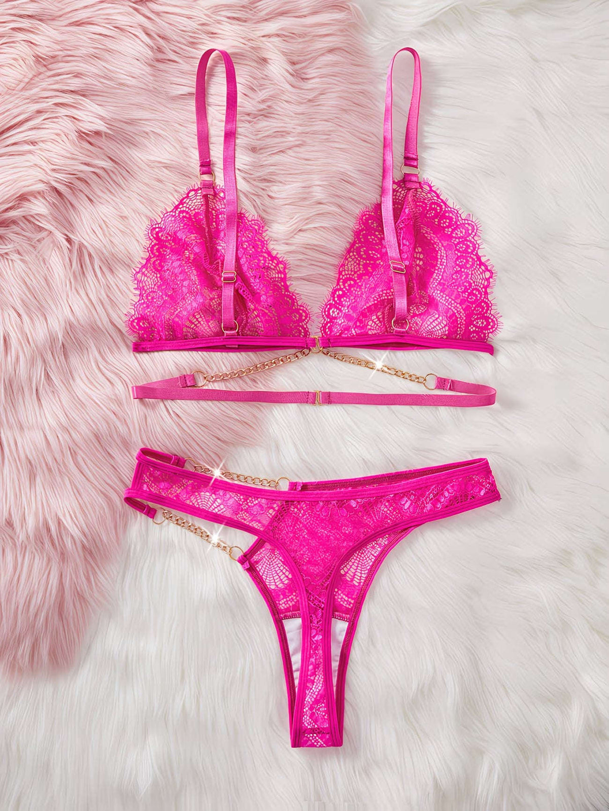 Pink lace lingerie set on a fluffy pink surface | Flat lay view displaying hot pink geometric lace bra and thong set - Bikinisexzy | Bikinisexzy.com