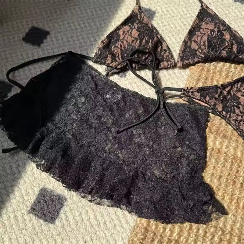 Lace lingerie set on a textured surface BIKINISEXZY sexy 3-piece hollow-out tankini set front view
