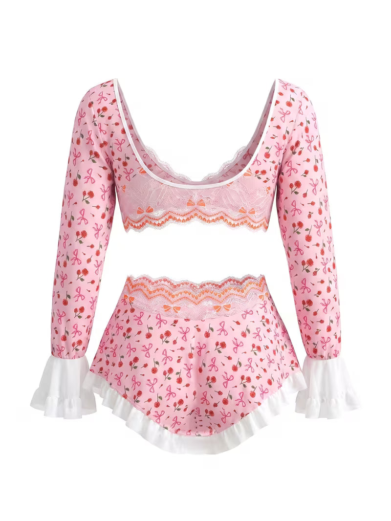 Flat lay back view of pink cherry print long sleeve crop top and ruffle trim booty skirt set on white background - Bikinisexzy 