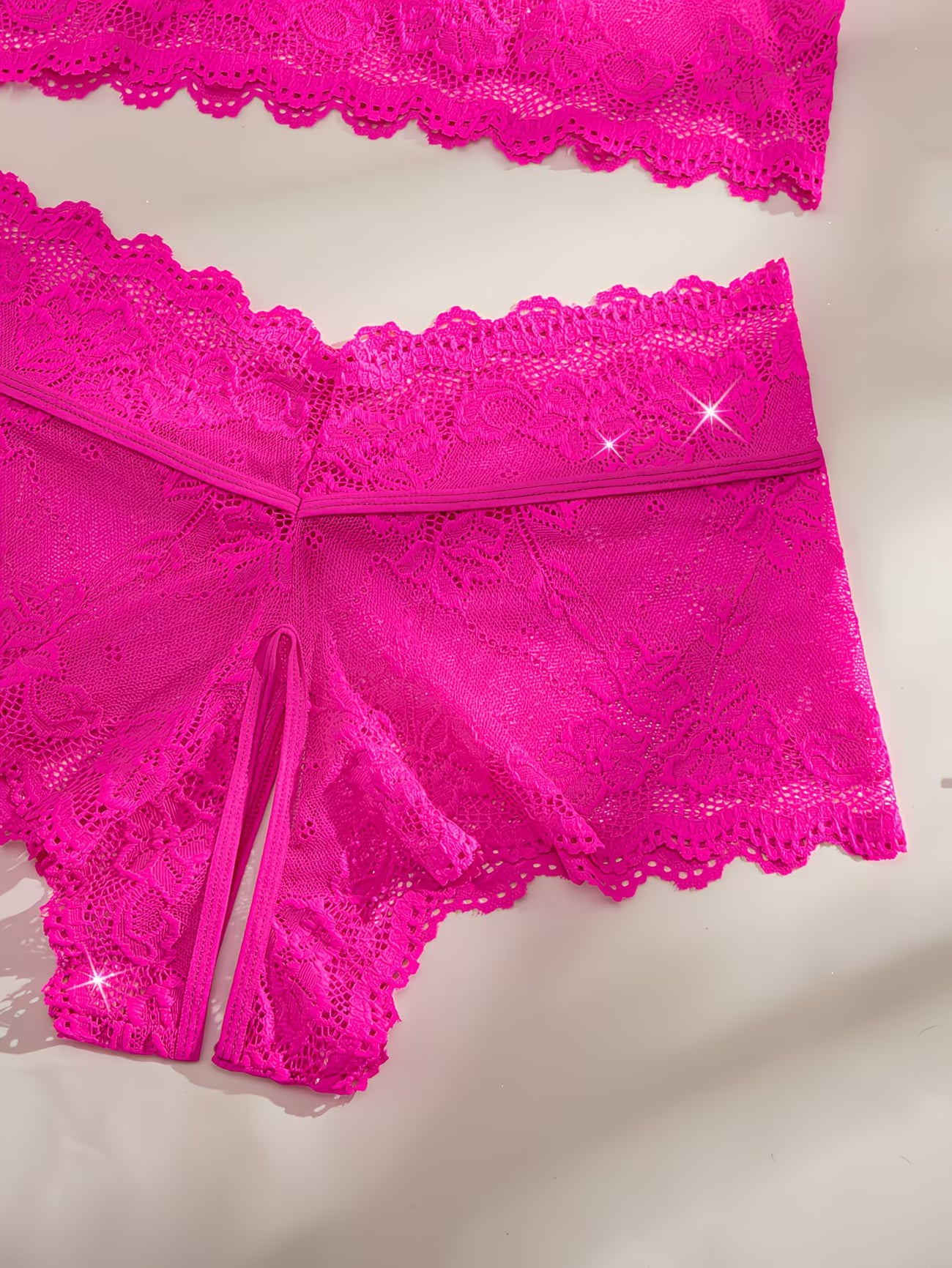 Bikinisexzy rose pink floral lace bralette with bow tie straps on pink satin background