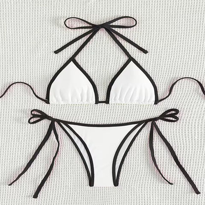 White bikini with black straps on a light gray background.BIKINISEXZY tie on side sexy beach bikini set
