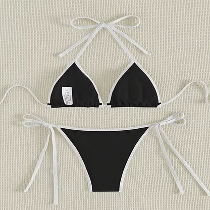 Black bikini set with white bows on a beige textured and BIKINISEXZY triangle thong two-piece swimsuit design