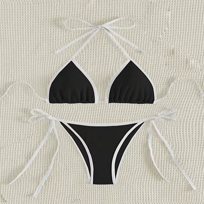 Black bikini set with white strings on a beige textured and BIKINISEXZY triangle thong two-piece swimsuit design