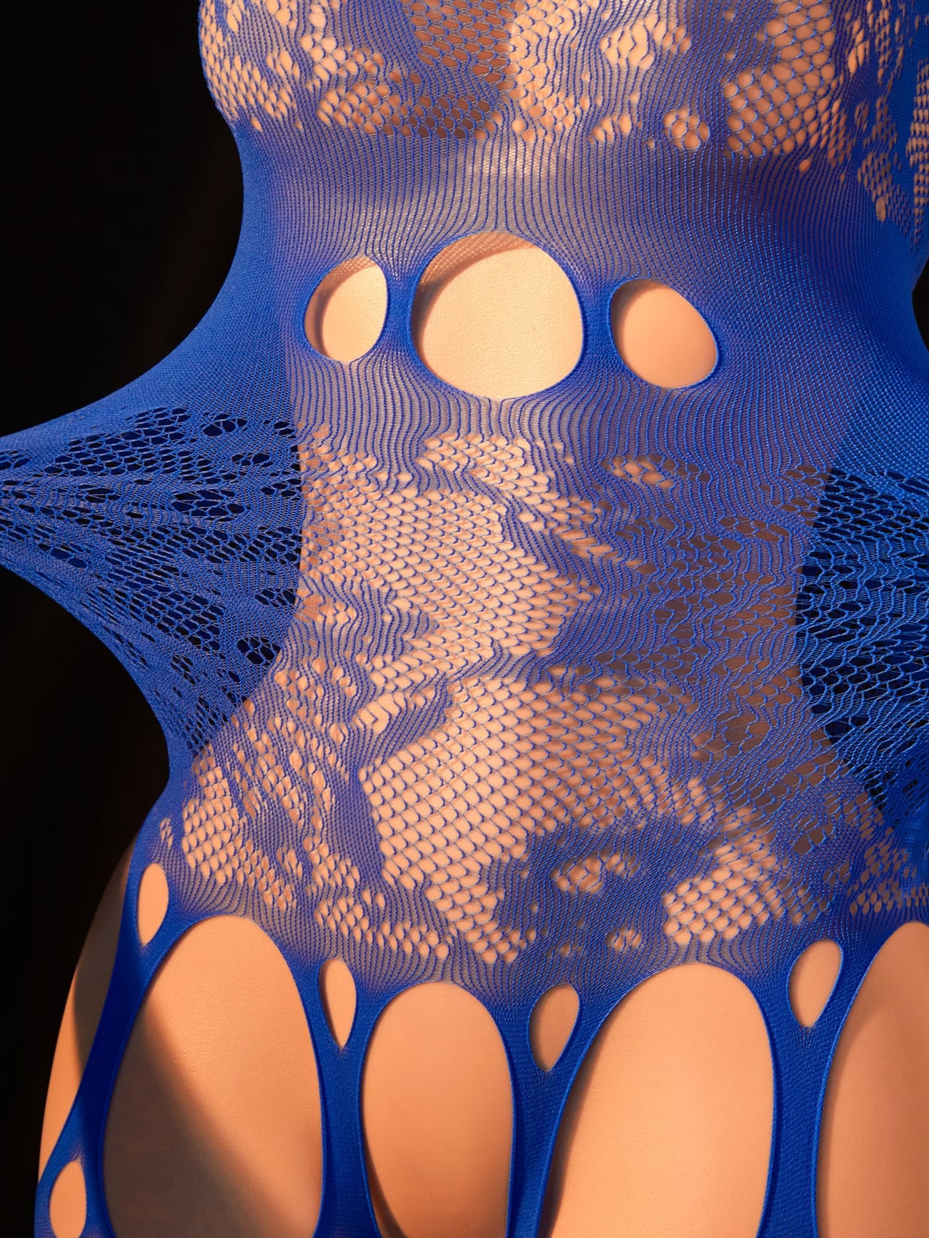 Detailed close-up of the exquisite blue floral pattern and hollow design by Bikinisexzy.