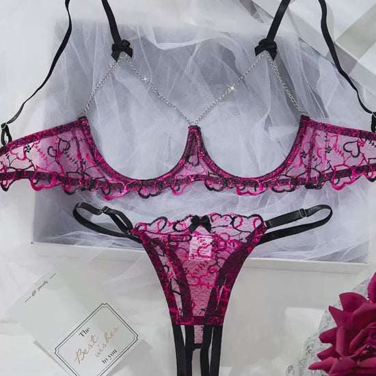 Flat lay back view displaying adjustable straps and back closure on lace bralette set